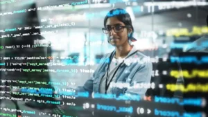 Programmer reflected by screen reviewing code