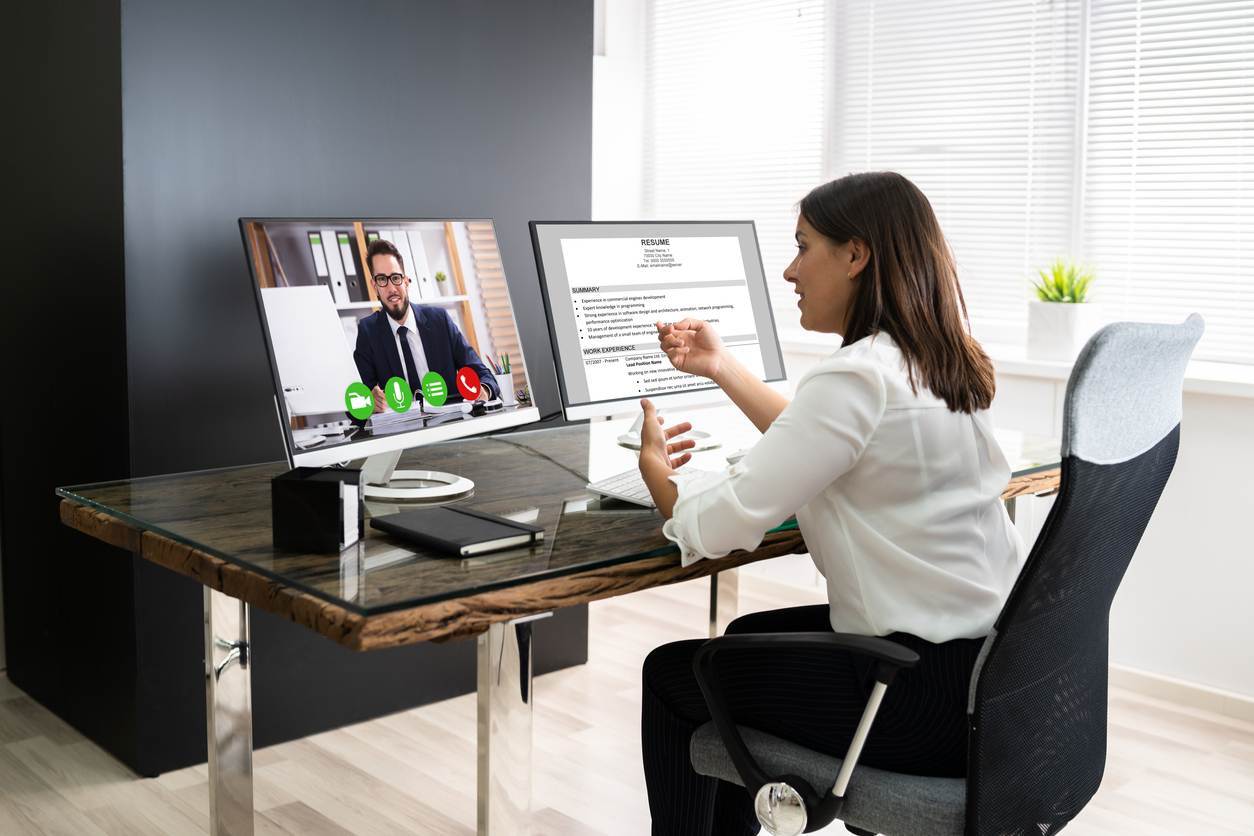 Our Services include video calls made by a woman in a business suit using a computer.