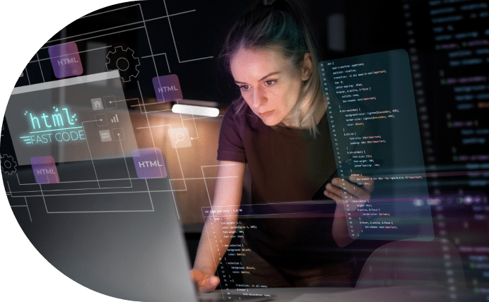 Woman programming with multiple screens displaying code and html elements.